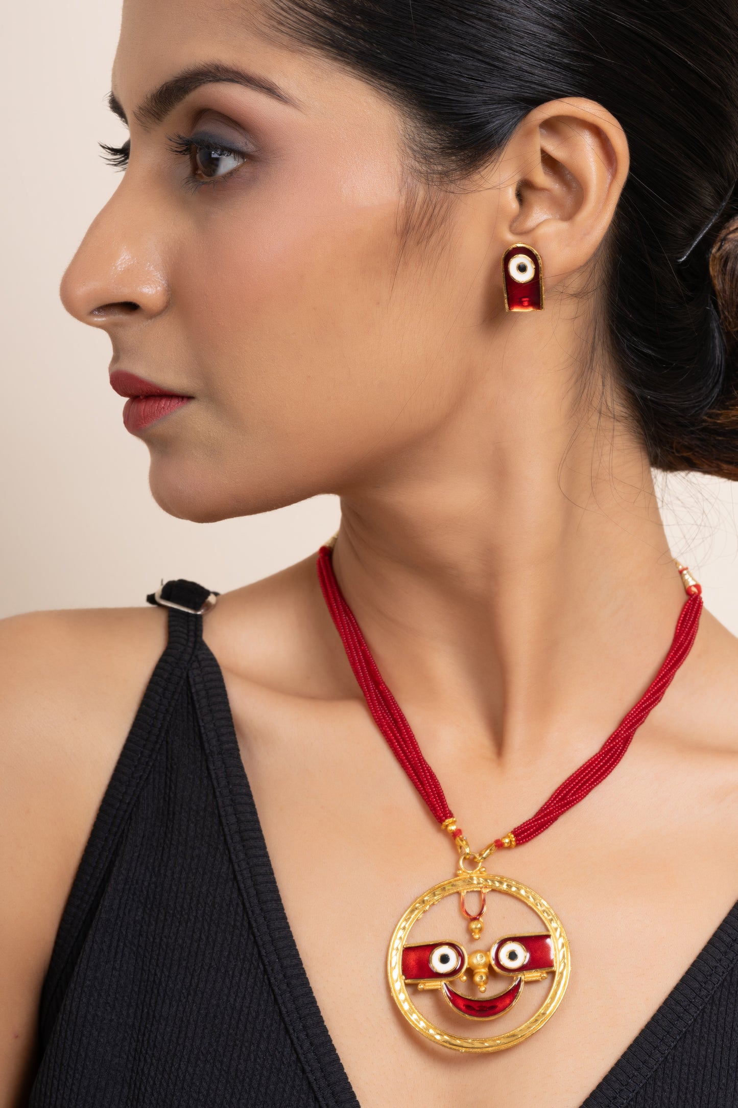 Gold Plated Meenakari Round Jagannath Pendant Neckpiece Set with Matching Earring and Red Tussle