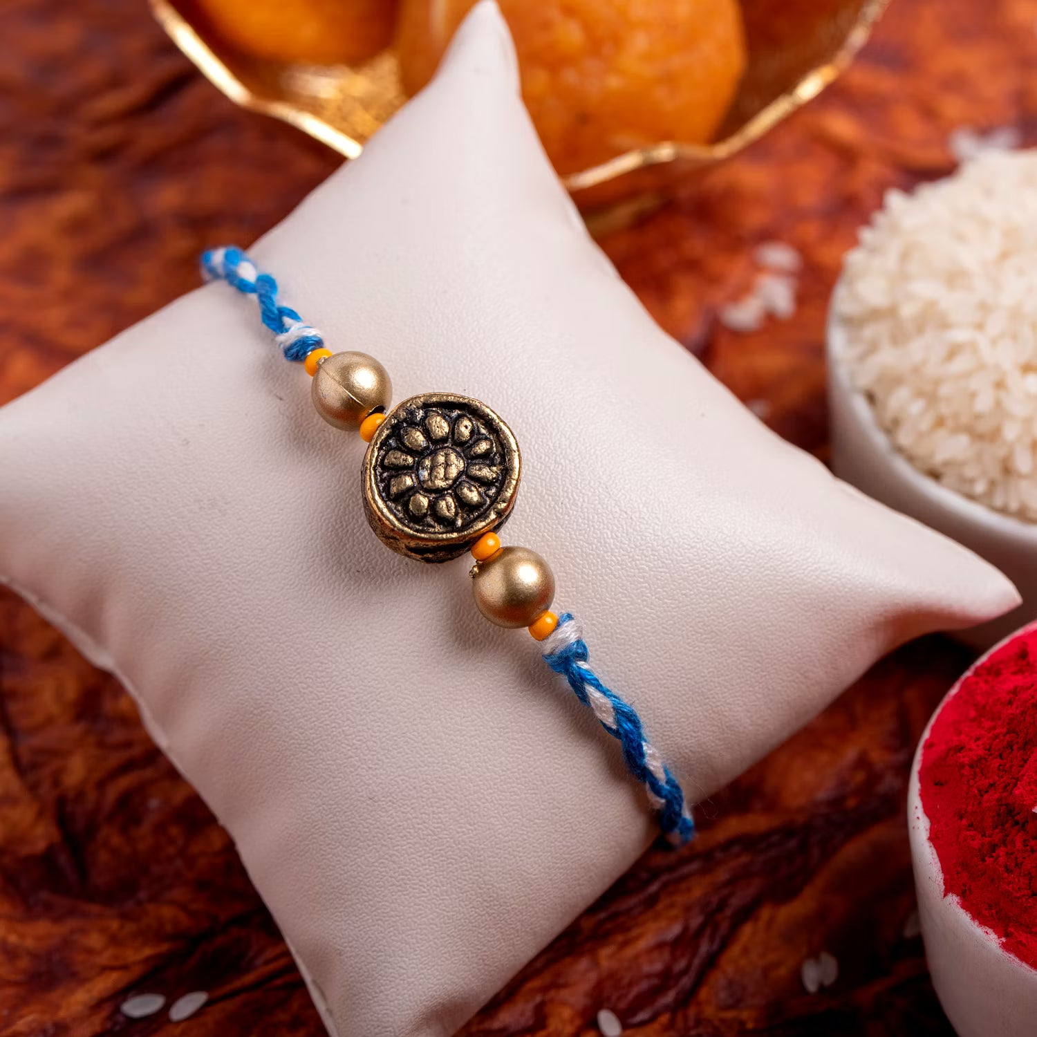 Designer Circular Golden bead Rakhi with Roli Chawal