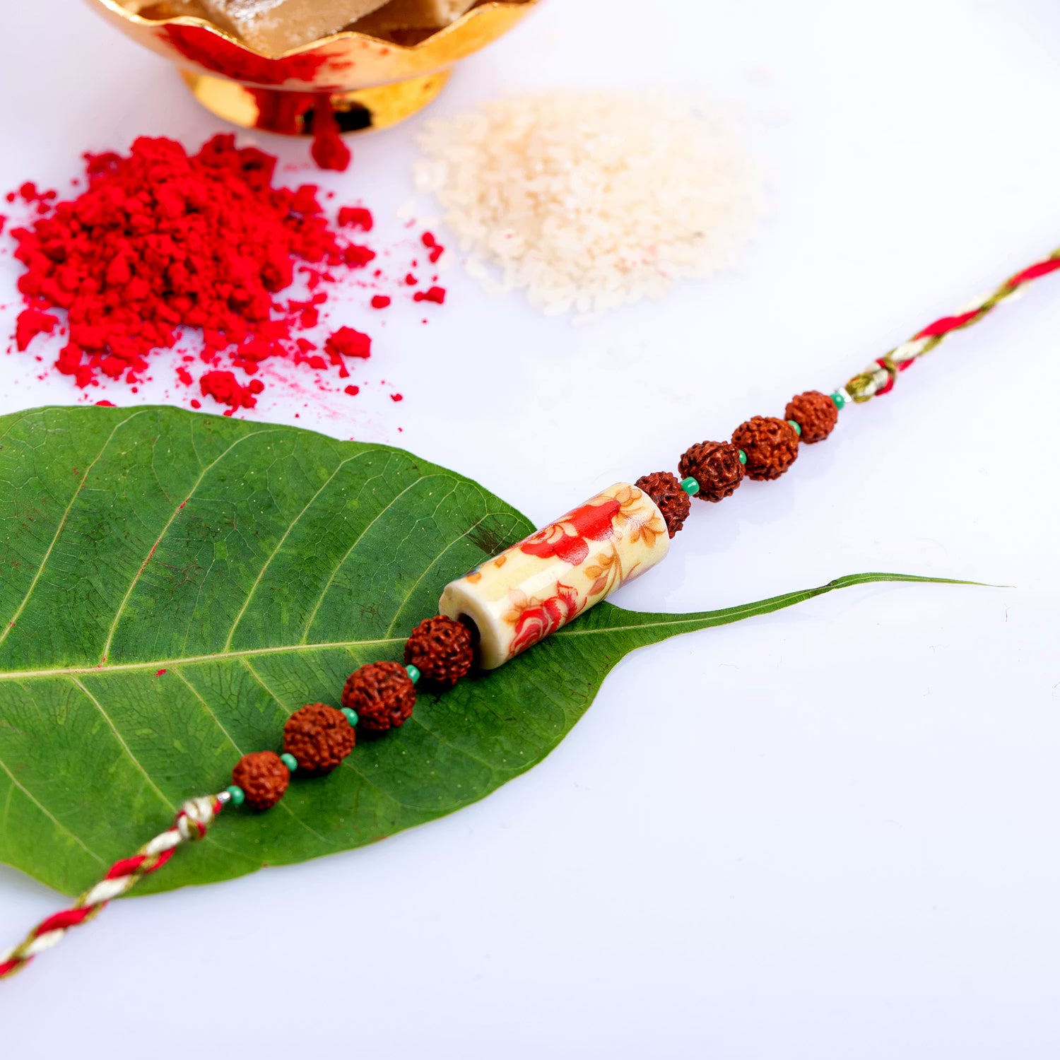 Designer Floral Ceramic Rudraksh Rakhi with Roli Chawal