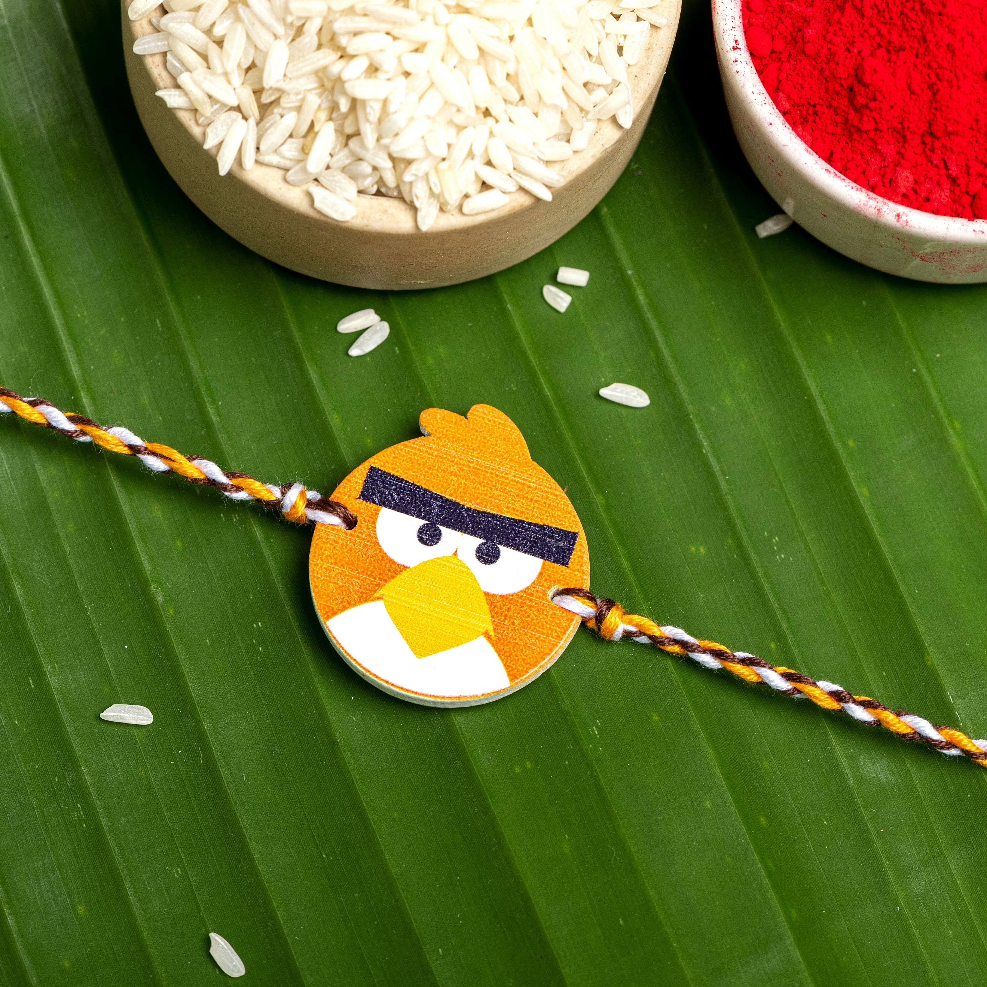 Wooden Orange Angry Bird Rakhi for Kids with Roli Chawal - Lookandadorn.com