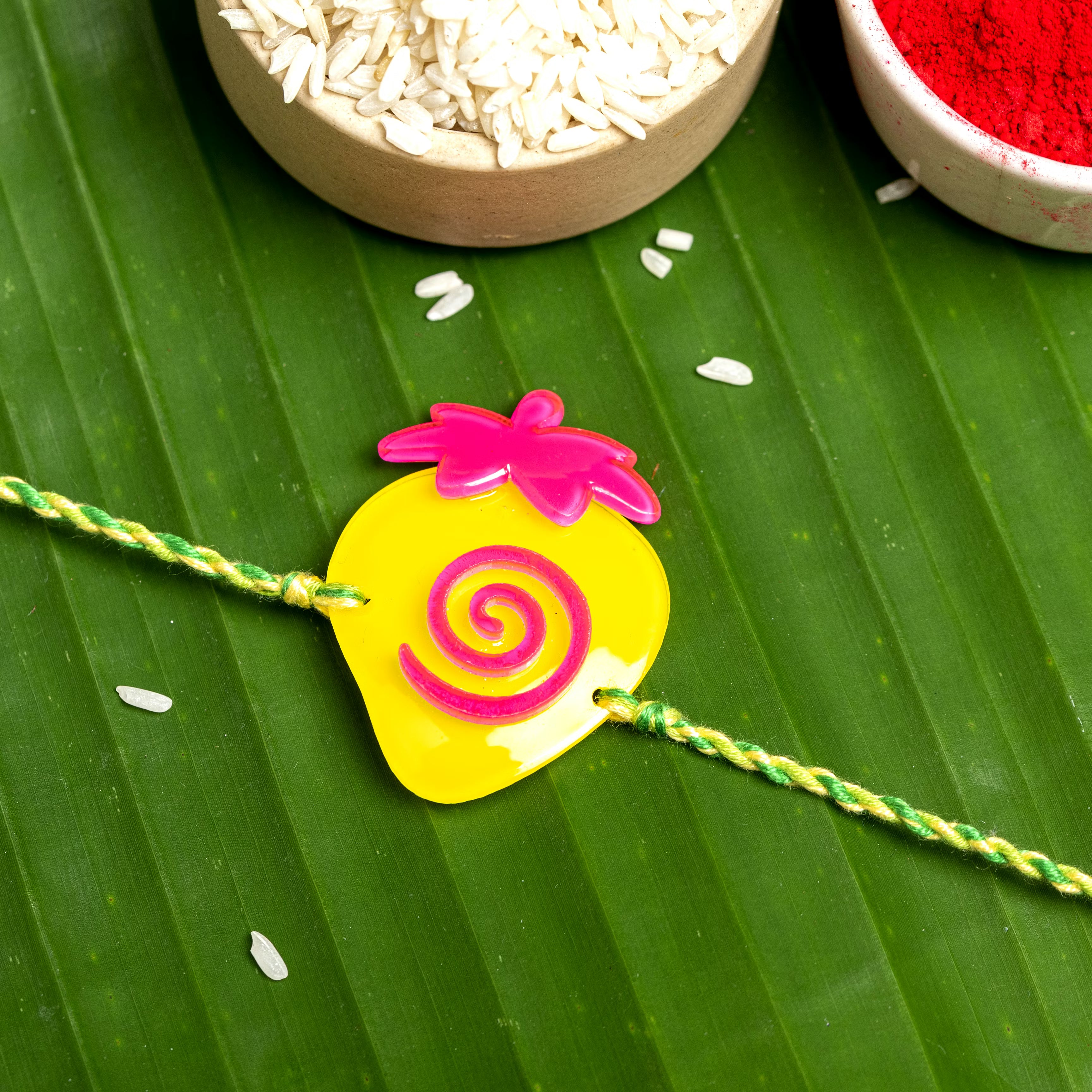 Acrylic Yellow Pink Strawberry with Green Yellow Dori Rakhi and Roli Chawal for Boys & Kids - Lookandadorn.com