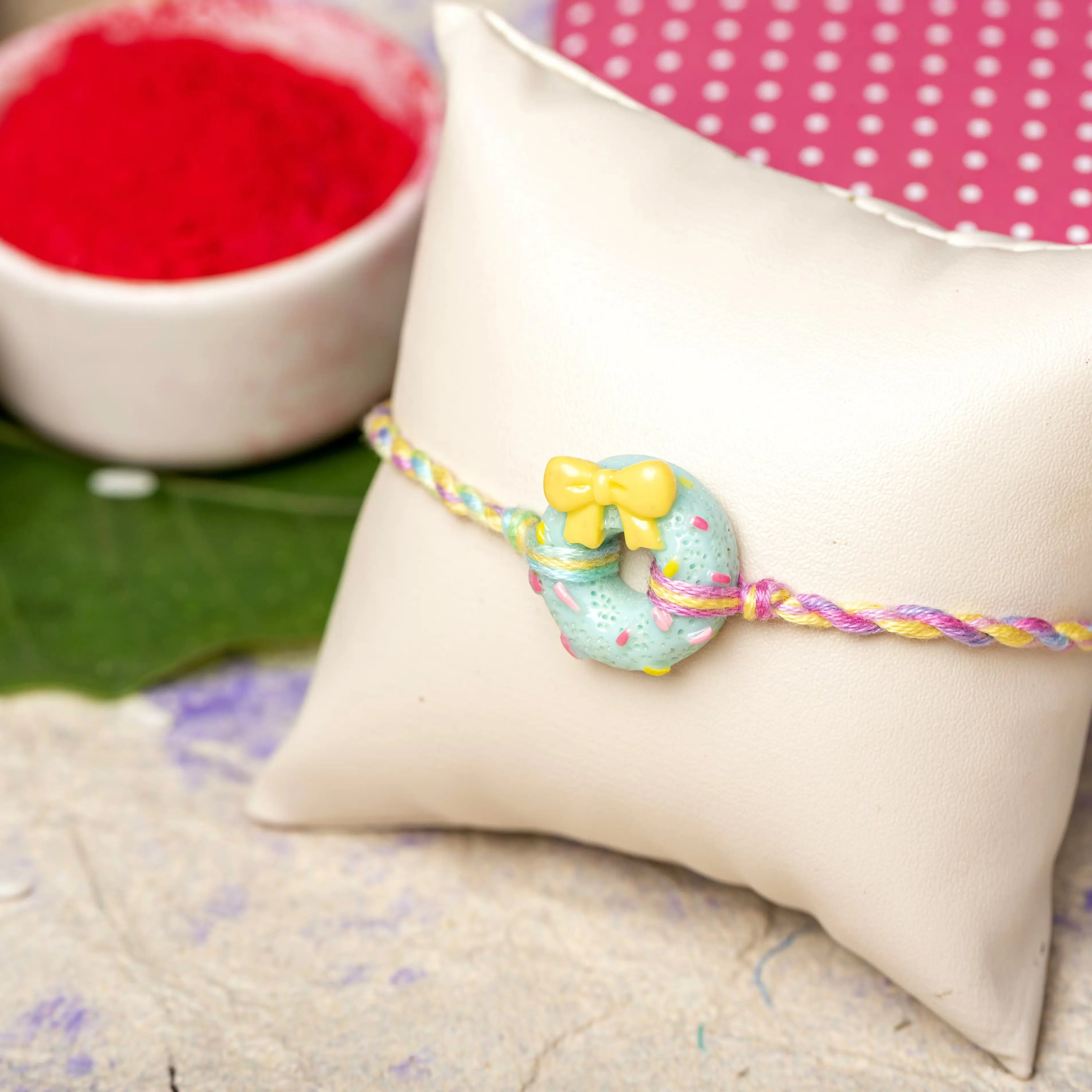 Acrylic Mint Green Doughnut Rakhi with Pastel Multicolor Dori Roli Chawal for Boys & Kids - Lookandadorn.com