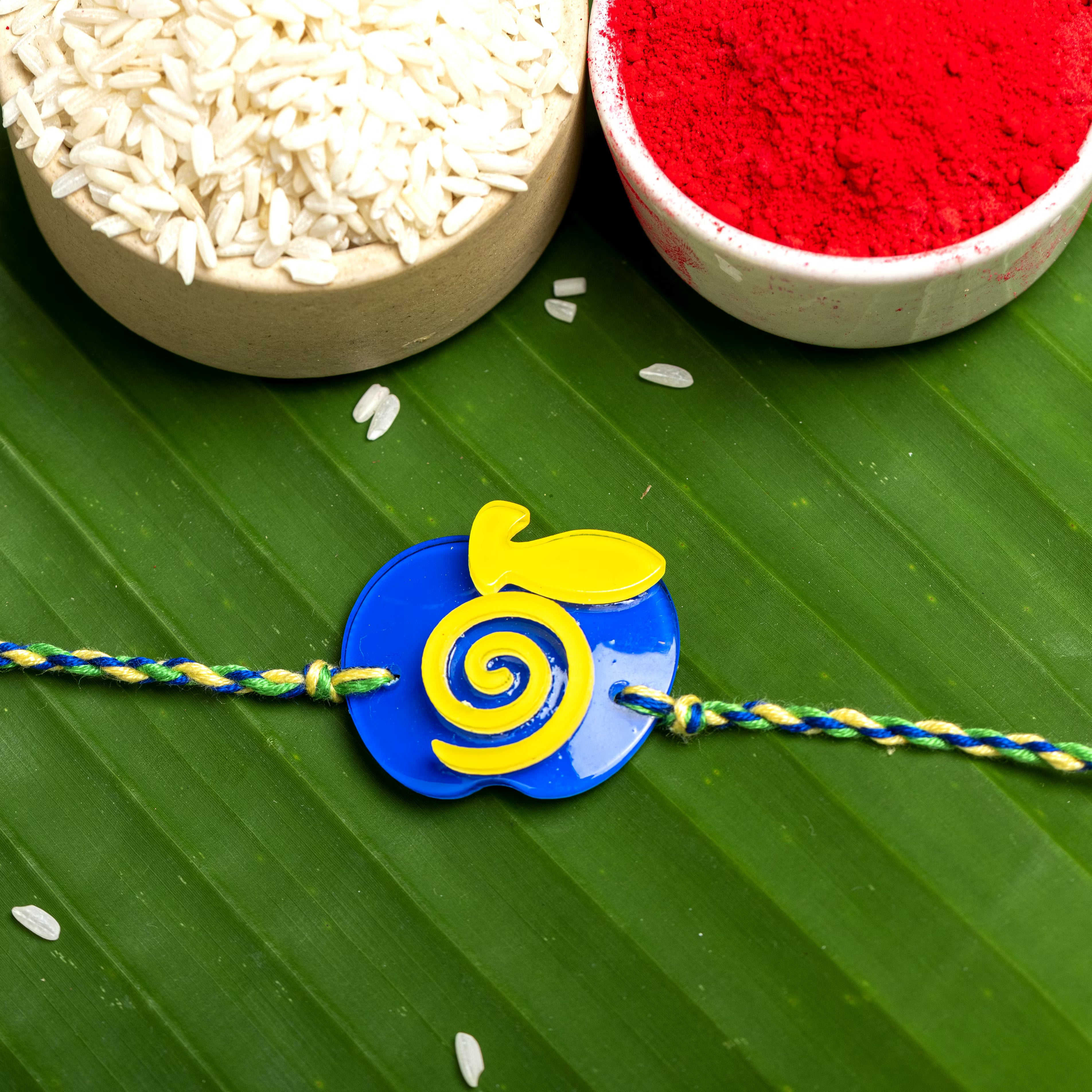 Acrylic Blue Yellow Apple Rakhi with Blue Green Yellow Dori Roli Chawal for Boys and Kids - Lookandadorn.com
