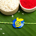 Acrylic Blue Yellow Apple Rakhi with Green Yellow Dori Roli Chawal for Boys and Kids - Lookandadorn.com