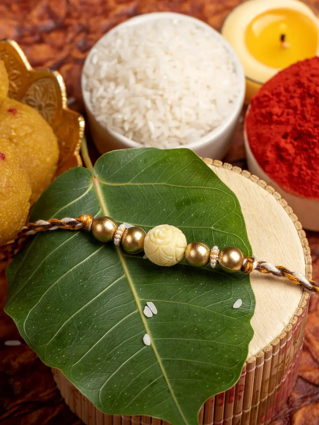 Handmade Beige Carved Bead Focal Golden Rakhi for Men and Boys with Roli Chawal - Lookandadorn.com
