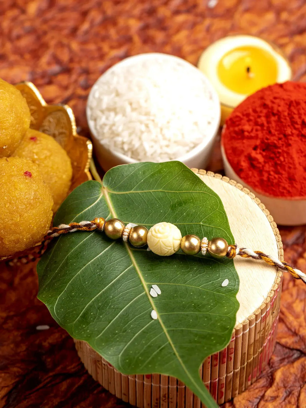 Handmade Beige Carved Bead Focal Golden Rakhi for Men and Boys with Roli Chawal - Lookandadorn.com