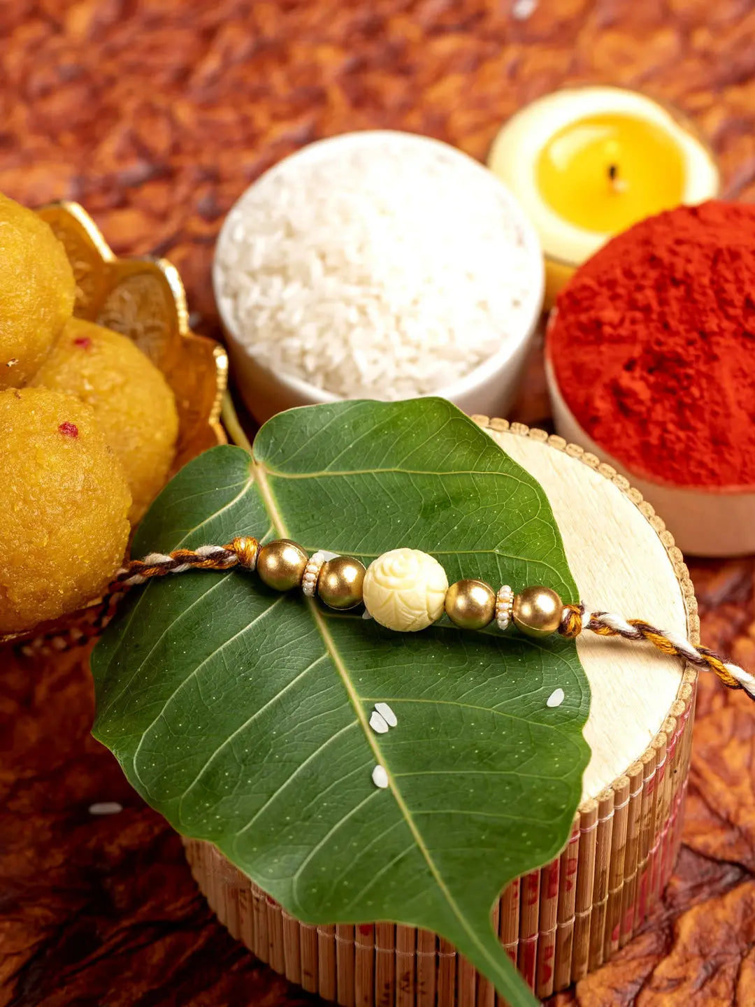 Handmade Beige Carved Bead Focal Golden Rakhi for Men and Boys with Roli Chawal - Lookandadorn.com