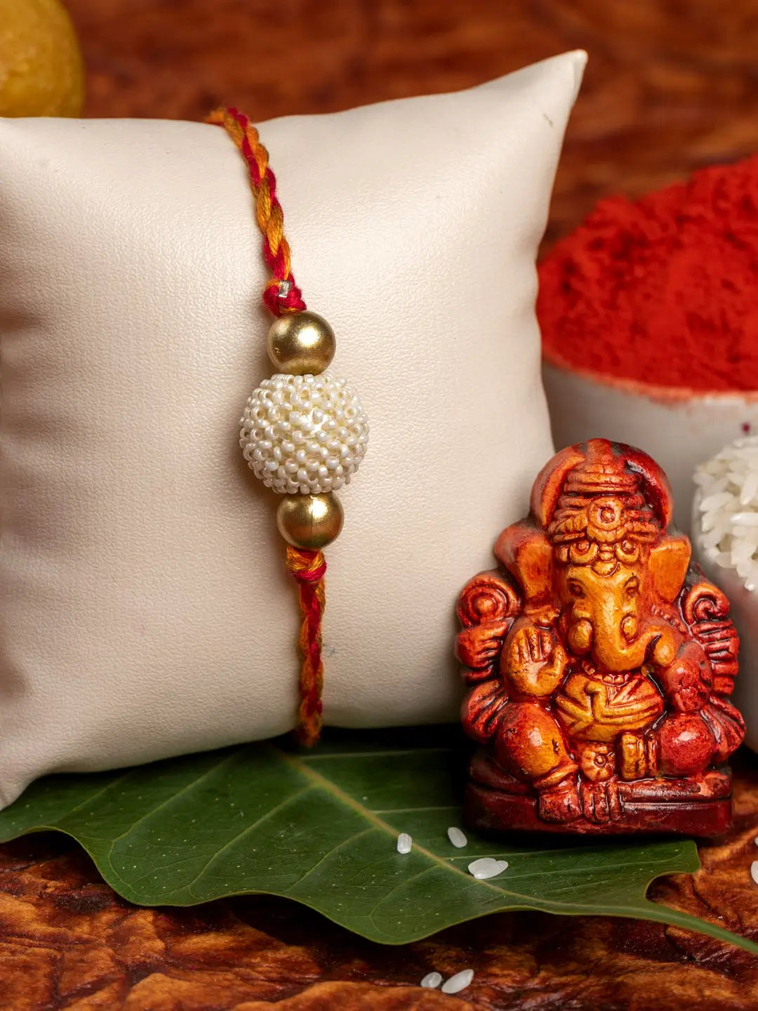 Handmade Beaded Pearl Golden Rakhi for Men and Boys with Roli Chawal - Lookandadorn.com