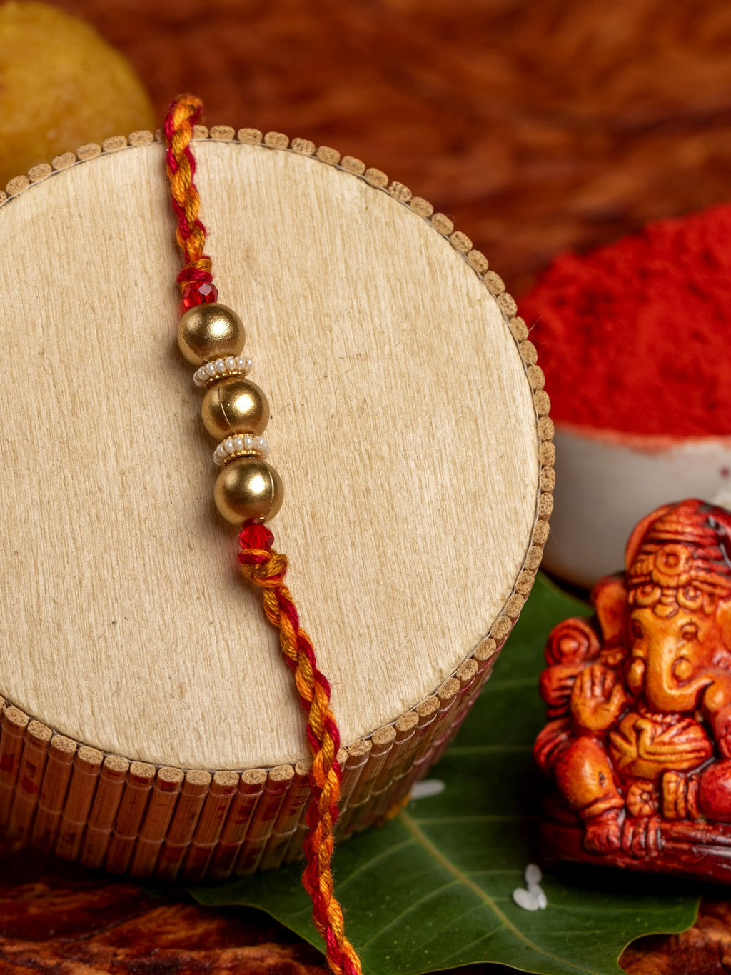 Designer Triplet Golden Bead Rakhi for Men and Boys with Roli Chawal - Lookandadorn.com