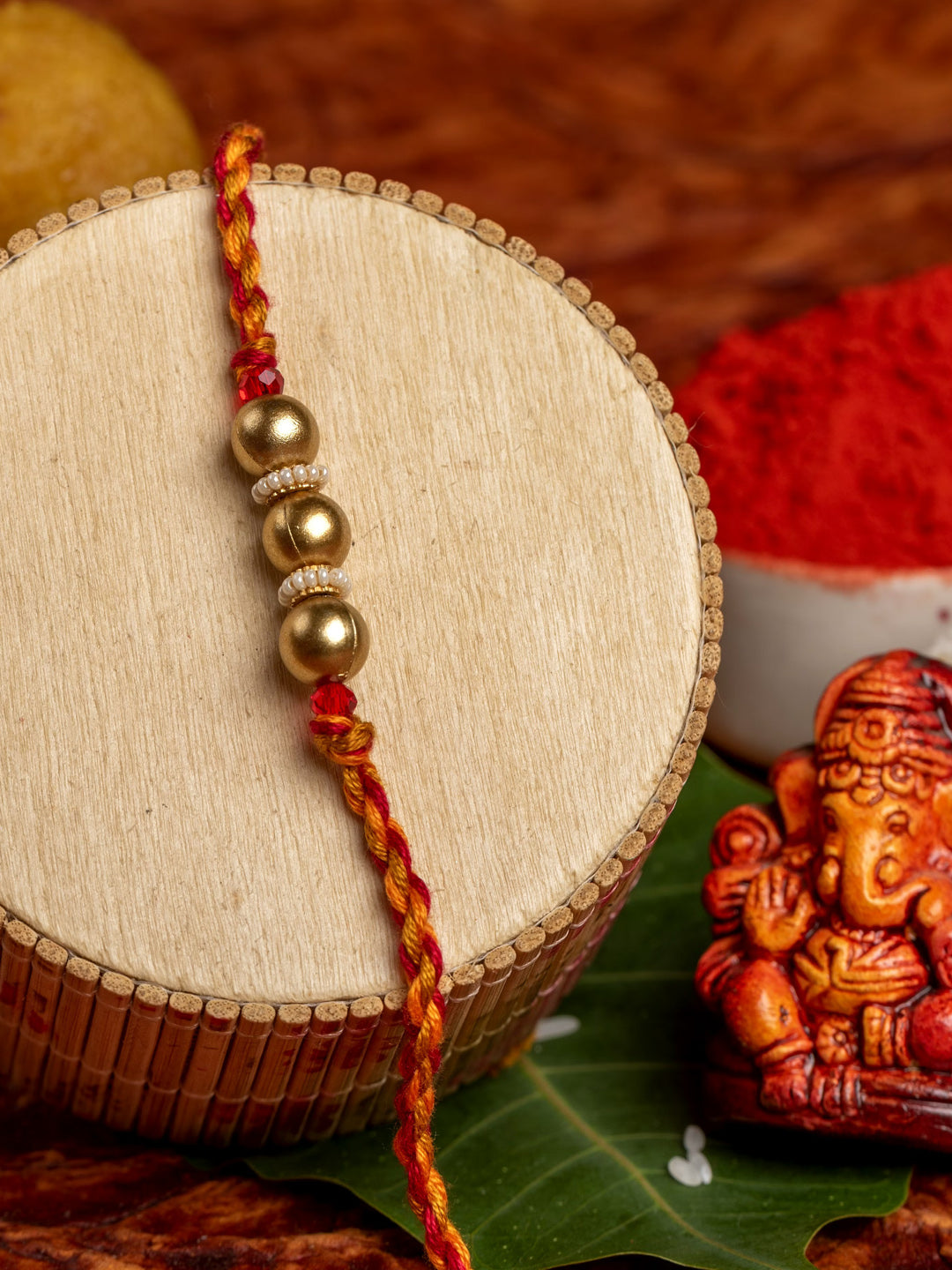 Designer Triplet Golden Bead Rakhi for Men and Boys with Roli Chawal - Lookandadorn.com