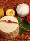 Handmade Red Carved Bead Focal Golden Rakhi for Men and Boys with Roli Chawal - Lookandadorn.com