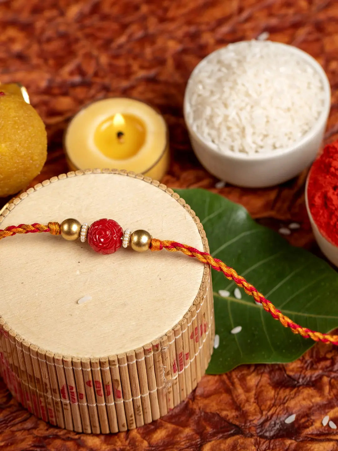 Handmade Red Carved Bead Focal Golden Rakhi for Men and Boys with Roli Chawal - Lookandadorn.com