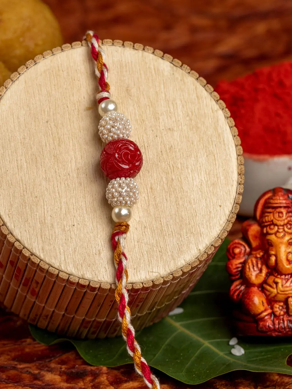 Handmade Red Cinnabar Beaded Pearl Rakhi for Men and Boys with Roli Chawal - Lookandadorn.com