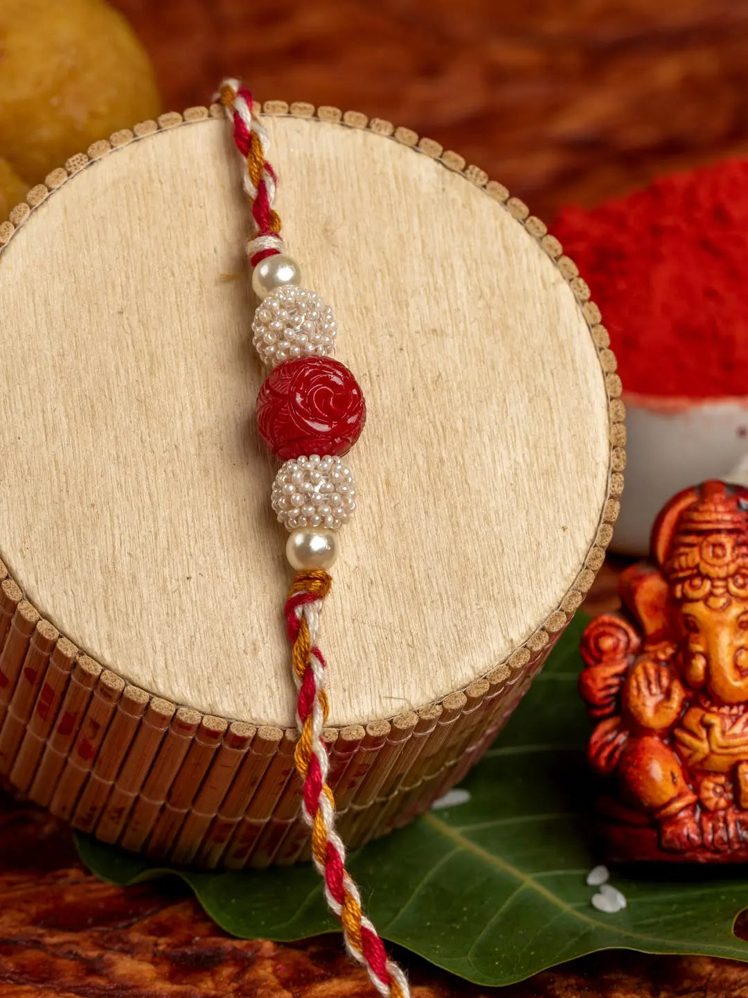 Handmade Red Cinnabar Beaded Pearl Rakhi for Men and Boys with Roli Chawal - Lookandadorn.com