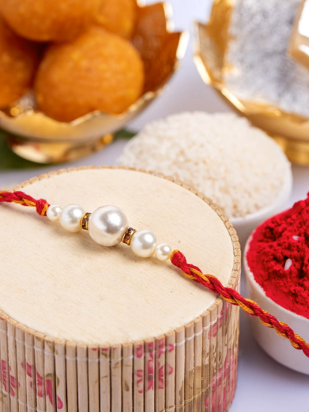 Handmade Designer Shell Pearl Rakhi with Roli Chawal - Lookandadorn.com