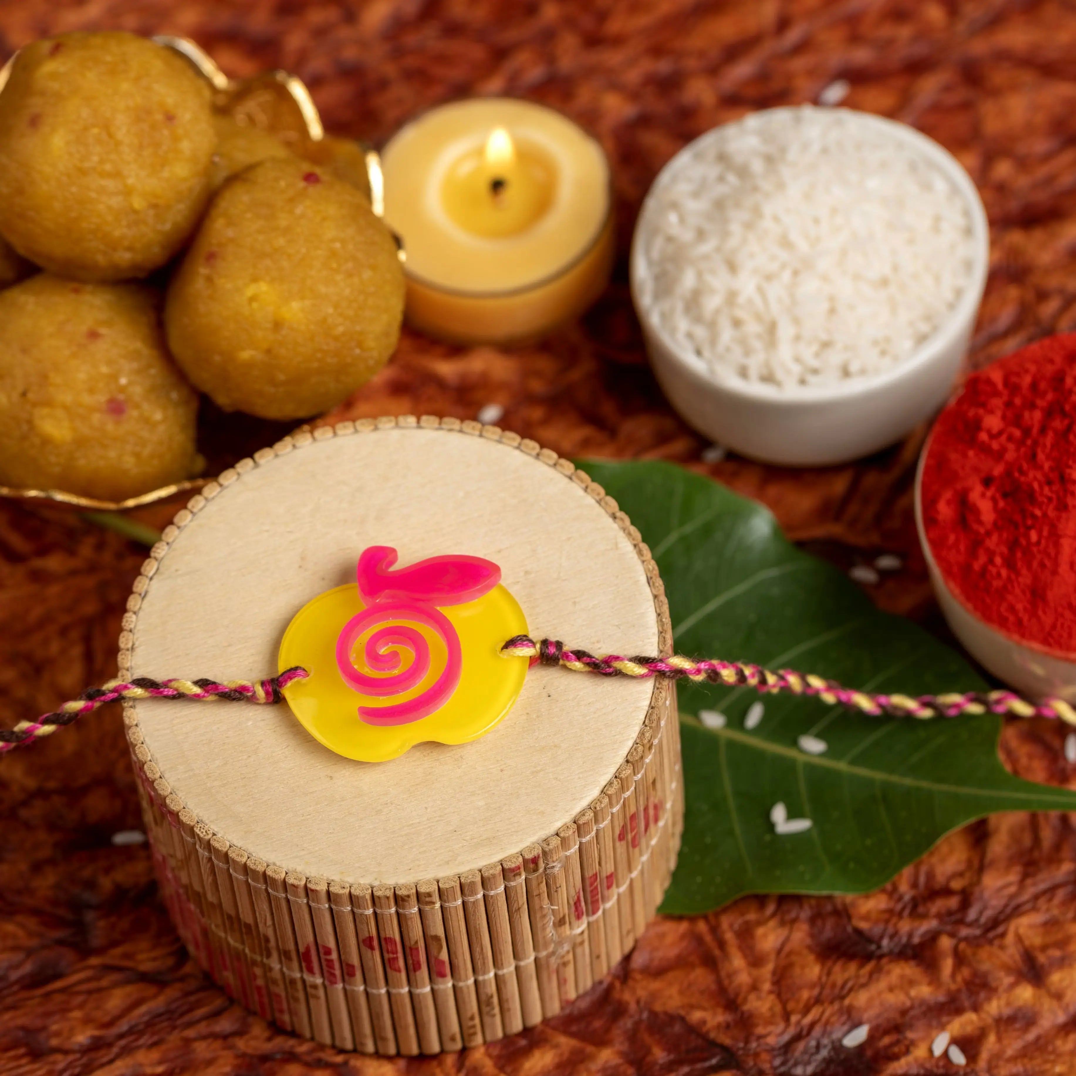 Acrylic Yellow Pink Apple Rakhi with Pink Yellow Dori Roli Chawal for Boys and Kids - Lookandadorn.com