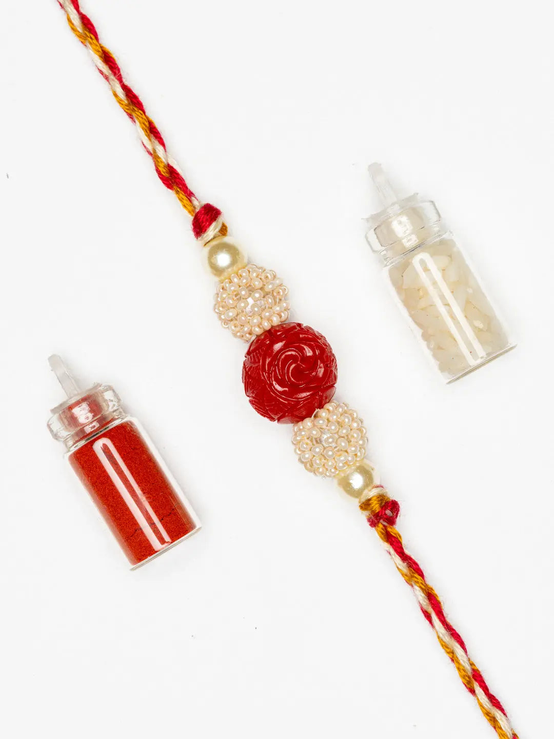 Handmade Red Cinnabar Beaded Pearl Rakhi for Men and Boys with Roli Chawal - Lookandadorn.com