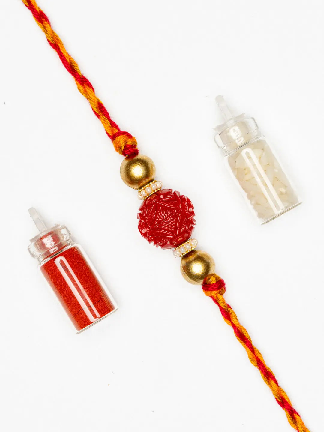 Handmade Red Carved Bead Focal Golden Rakhi for Men and Boys with Roli Chawal - Lookandadorn.com