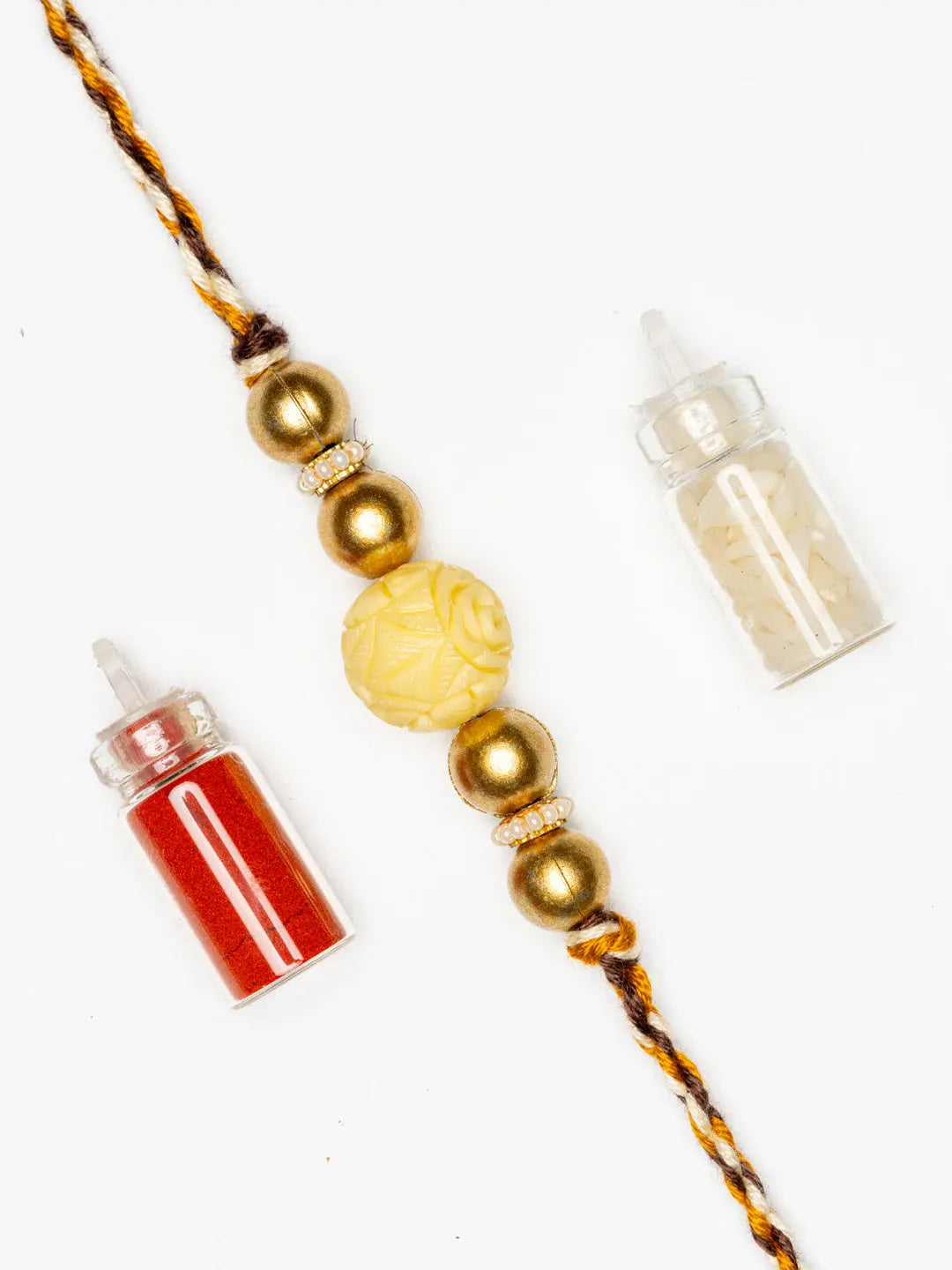 Handmade Beige Carved Bead Focal Golden Rakhi for Men and Boys with Roli Chawal - Lookandadorn.com