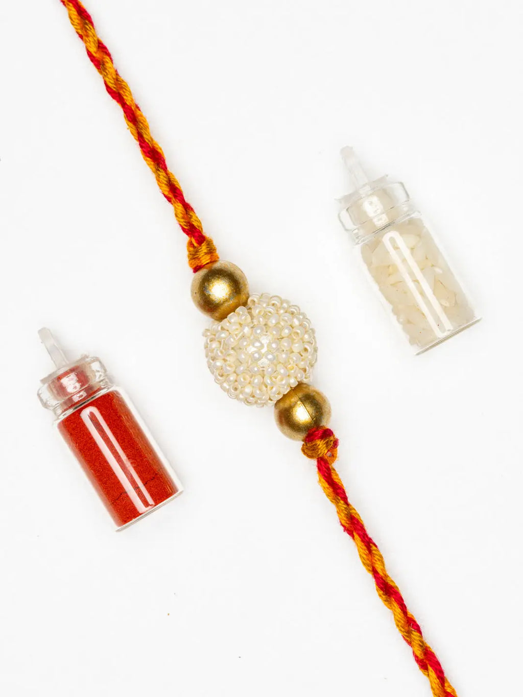 Handmade Beaded Pearl Golden Rakhi for Men and Boys with Roli Chawal - Lookandadorn.com