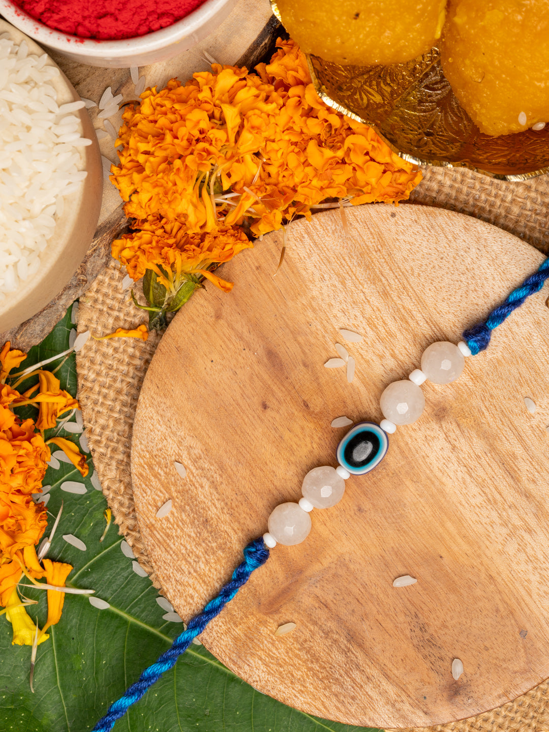 White Onyx and Blue Evil Eye Rakhi Set with Roli and Chawal - Handmade Designer Rakhi for Brothers - Lookandadorn.com