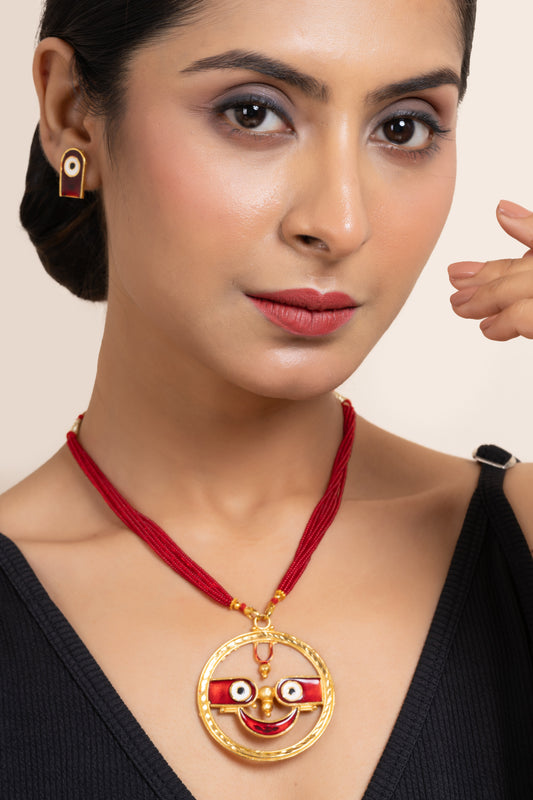 Gold Plated Meenakari Round Jagannath Pendant Neckpiece Set with Matching Earring and Red Tussle