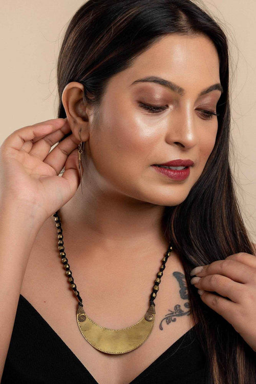 Designer Handcrafted Dokra Jewelry Brass Crescent Moon Pendant Neckpiece With Leaf Earrings Set - Lookandadorn.com