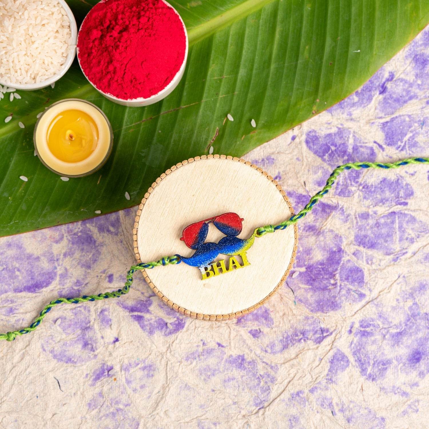 Hand-Painted Mustache Bhai Rakhi in Red and Blue with Roli and Chawal for Raksha Bandhan - Lookandadorn.com