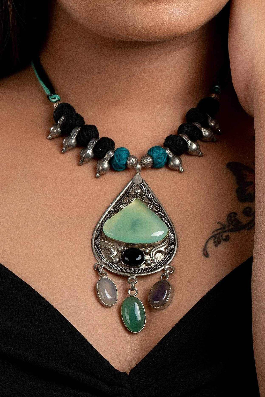 Designer Dual Tone Adjustable Cotton Dori Neckpiece with Semi Precious Stone Studded German Silver Pendant - Lookandadorn.com