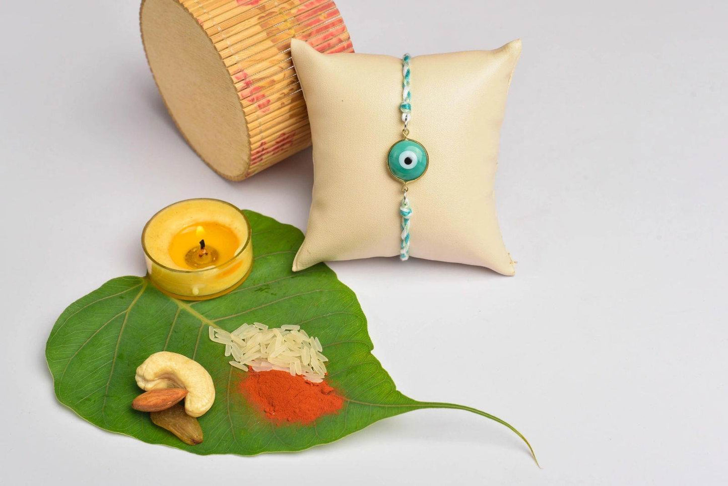 Designer White Mint Green Onyx Evil Eye Rakhi Set with Roli and Chawal for Raksha Bandhan - Lookandadorn.com