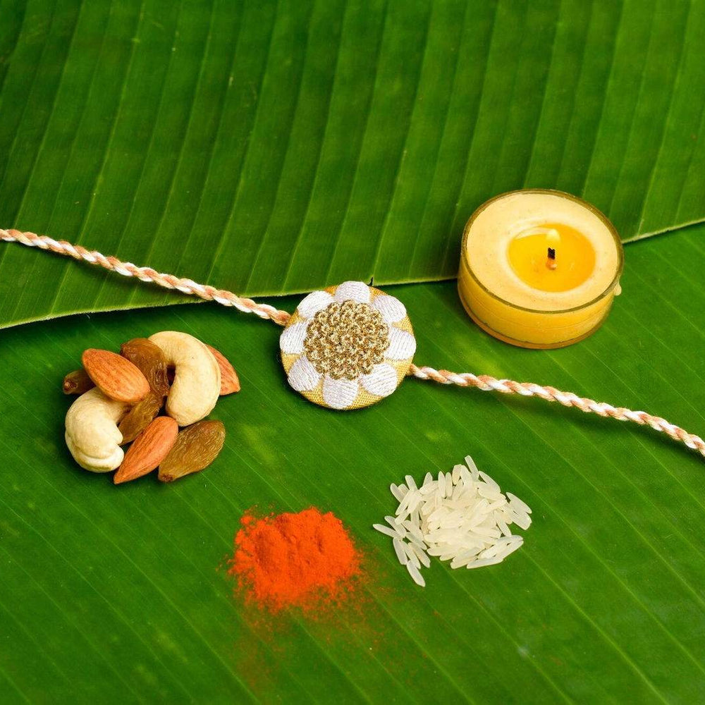 Elegant White Golden Floral Embroidery Rakhi Set with Roli and Chawal for Celebrating Raksha Bandhan - Lookandadorn.com