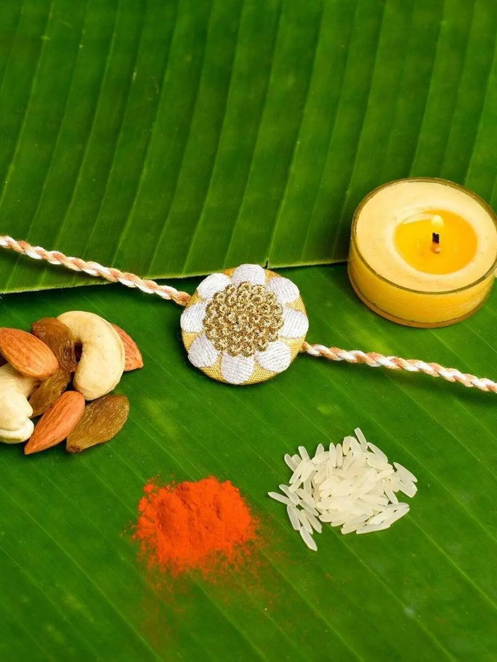 Elegant White Golden Floral Embroidery Rakhi Set with Roli and Chawal for Celebrating Raksha Bandhan - Lookandadorn.com