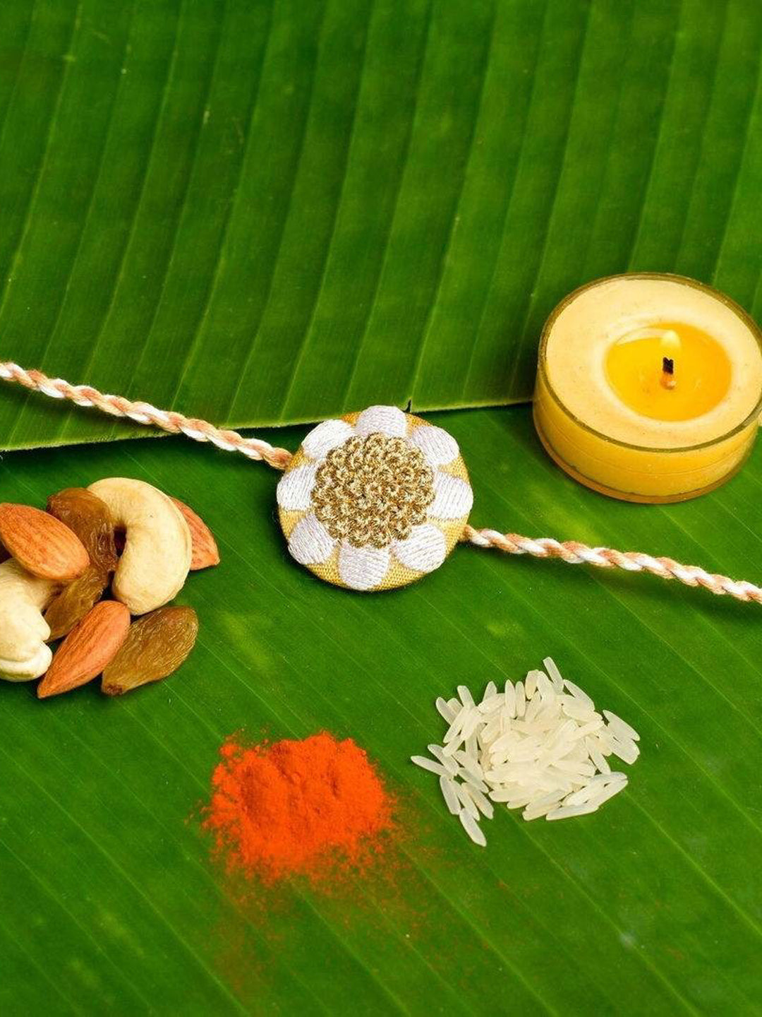 Elegant White Golden Floral Embroidery Rakhi Set with Roli and Chawal for Celebrating Raksha Bandhan - Lookandadorn.com