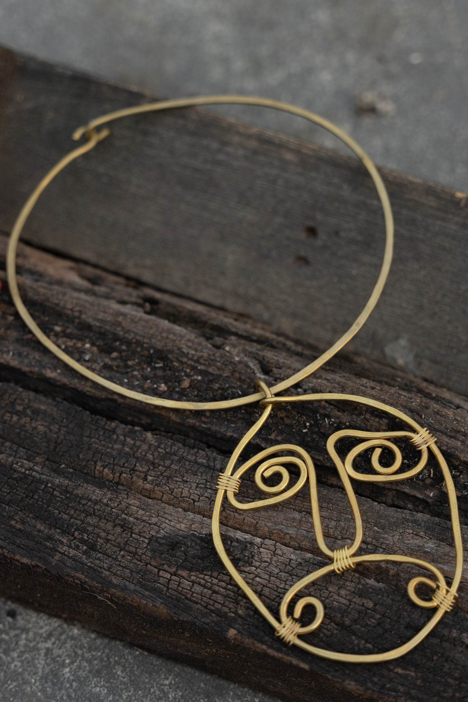 Handmade Dokra Brass Abstract Face Spiral Necklace - Unique Artistic Statement Jewelry - Lookandadorn.com