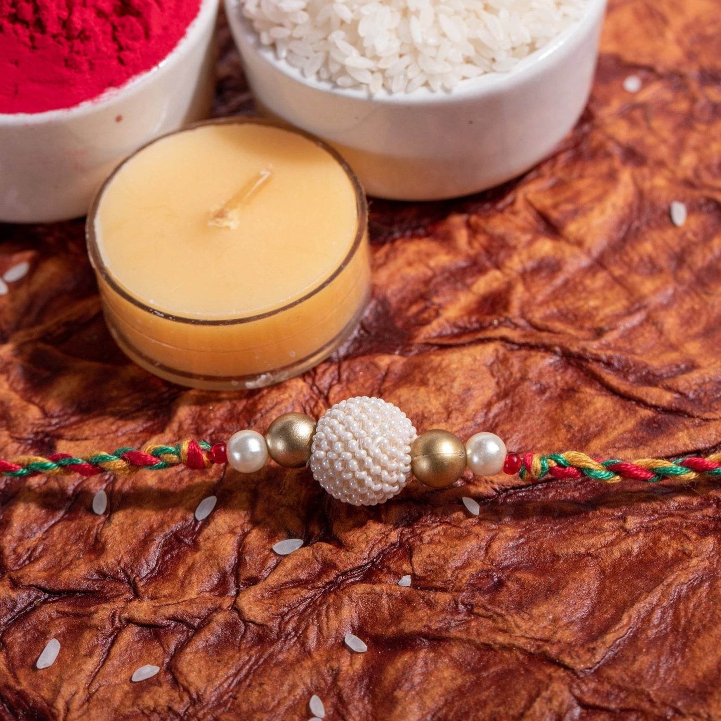 Handmade Pearl Focal Rakhi with Roli and Chawal - Unique Design for Raksha Bandhan Celebration - Lookandadorn.com