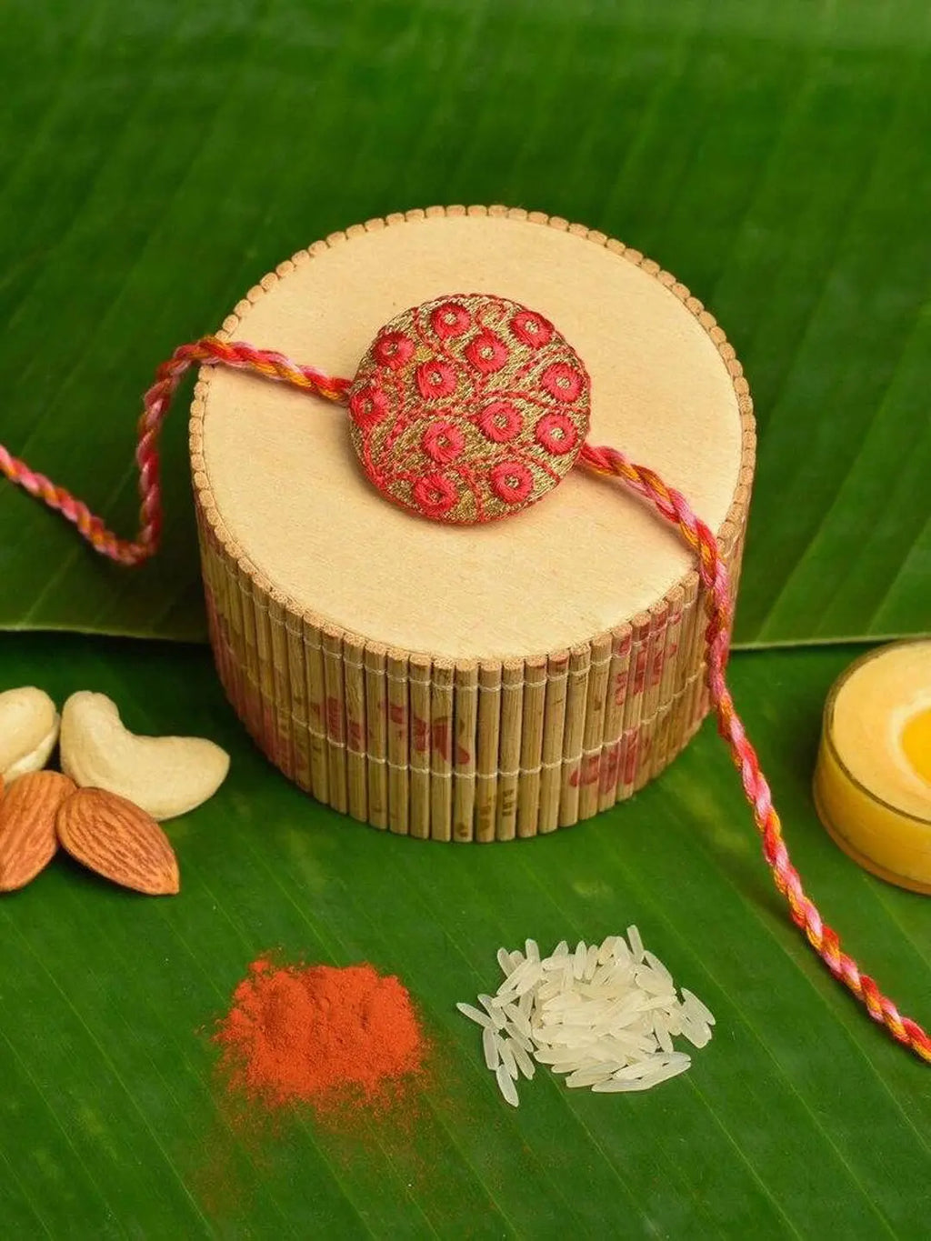 Handmade Red Golden Embroidery Set with Roli and Chawal for Brothers - Designer Rakhi Online - Lookandadorn.com