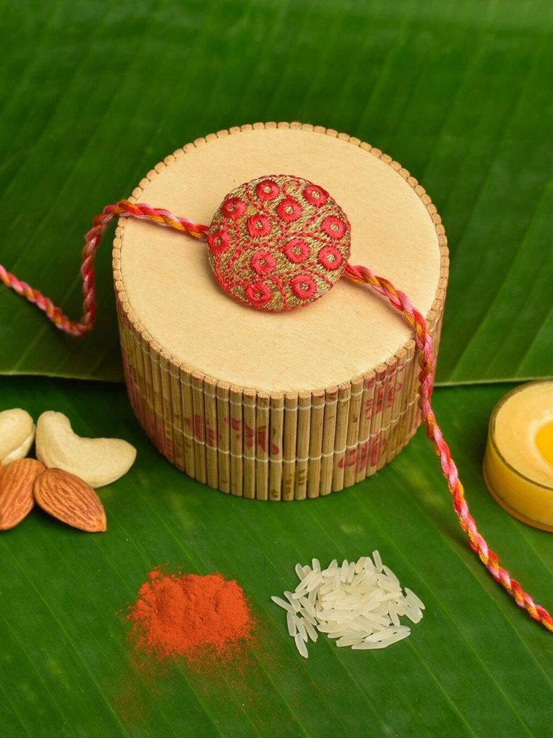 Handmade Red Golden Embroidery Set with Roli and Chawal for Brothers - Designer Rakhi Online - Lookandadorn.com