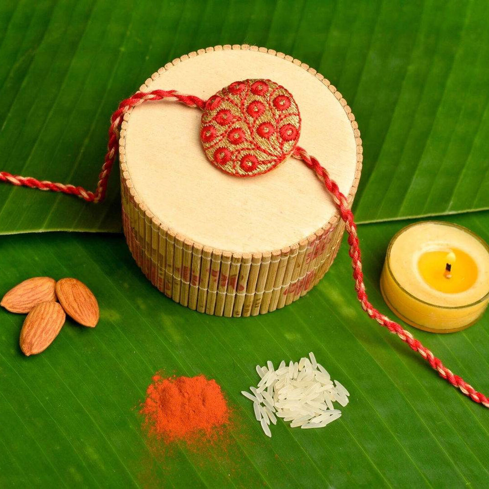 Handmade Red Golden Embroidery Set with Roli and Chawal for Brothers - Designer Rakhi Online - Lookandadorn.com