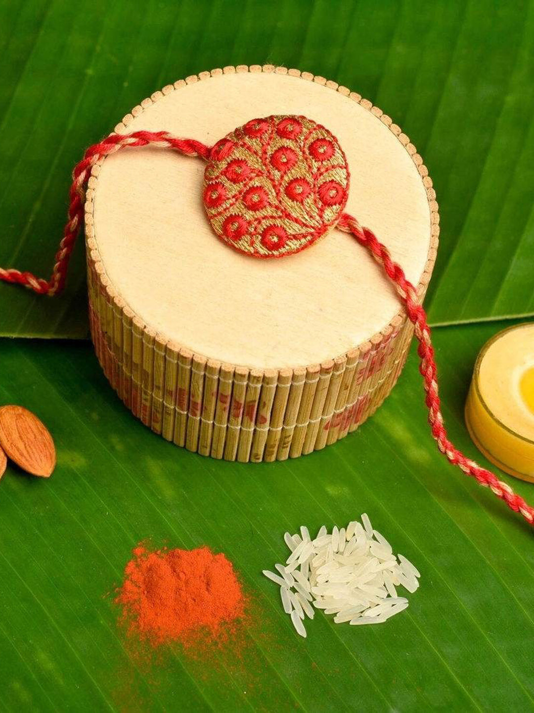 Handmade Red Golden Embroidery Set with Roli and Chawal for Brothers - Designer Rakhi Online - Lookandadorn.com