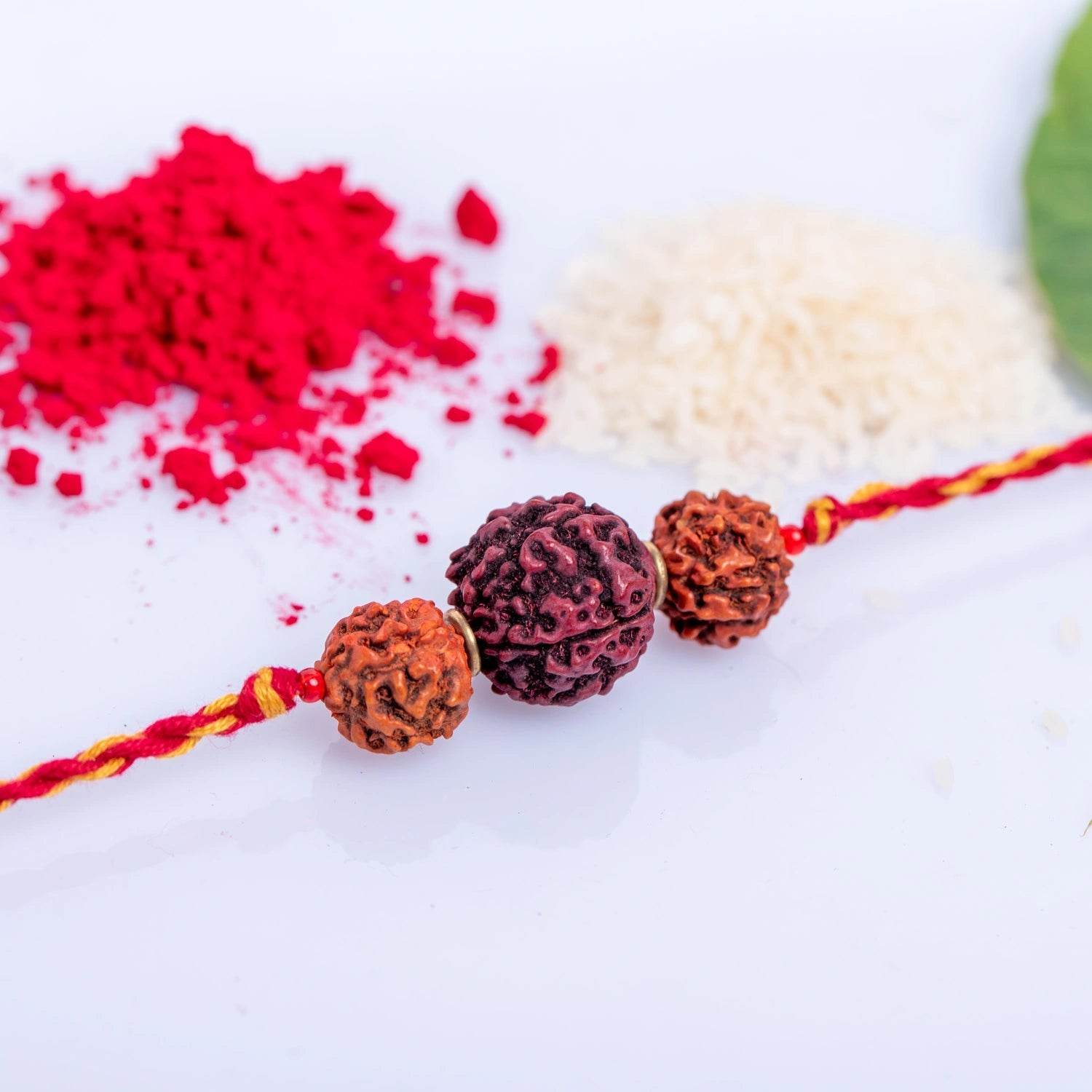 Handmade Designer Triplet Rudraksh Rakhi With Roli And Chawal For Raksha Bandhan Celebration - Lookandadorn.com