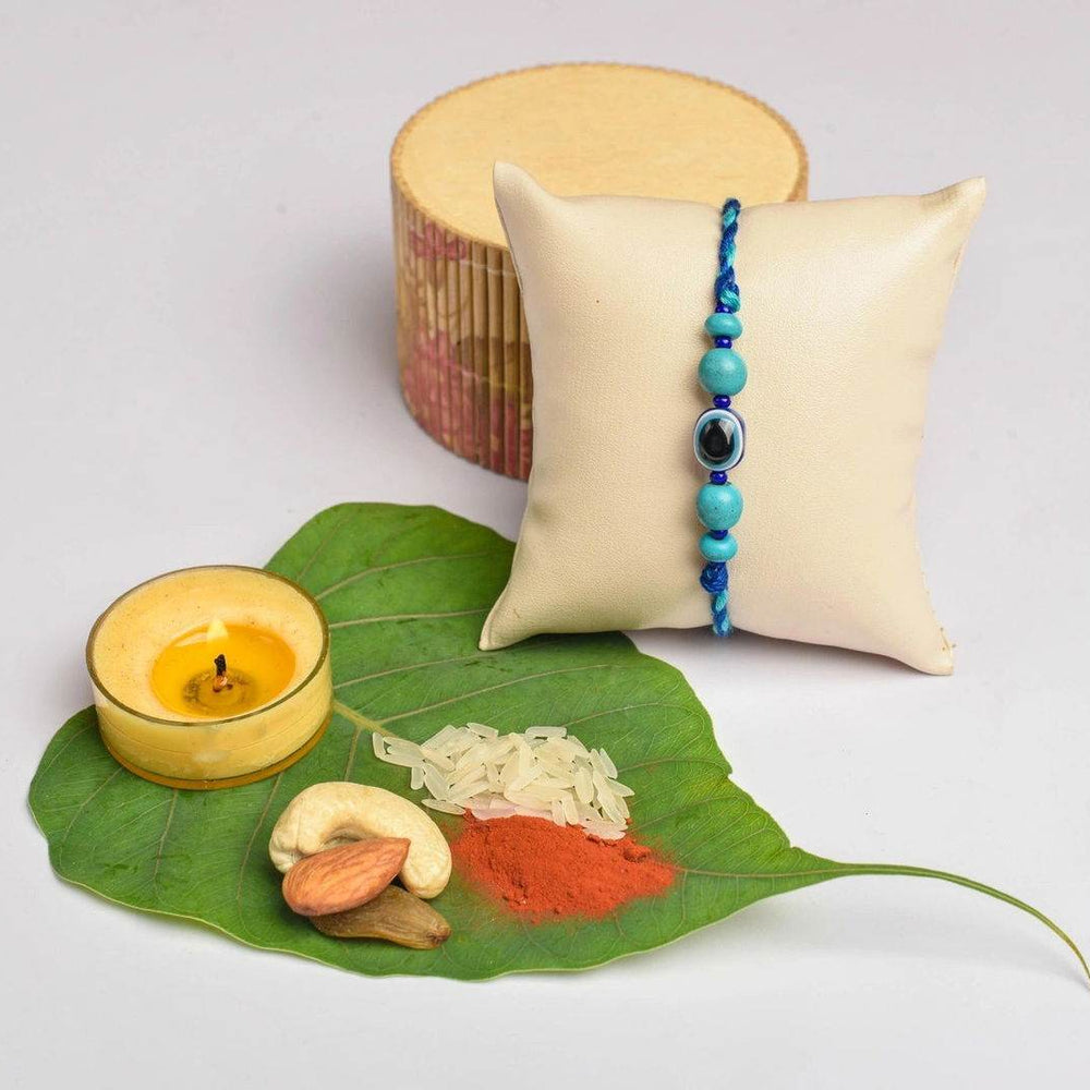 Turquoise Blue Onyx Evil Eye Rakhi With Roli & Chawal - Handmade Designer Rakhi For Brothers - Lookandadorn.com
