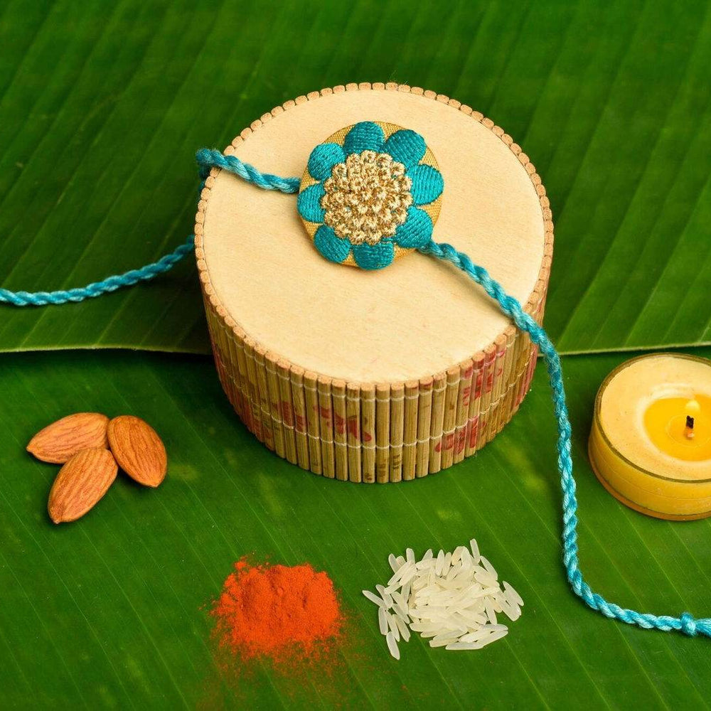 Handmade Turquoise Golden Designer Floral Embroidery Rakhi With Roli And Chawal For Brother - Lookandadorn.com