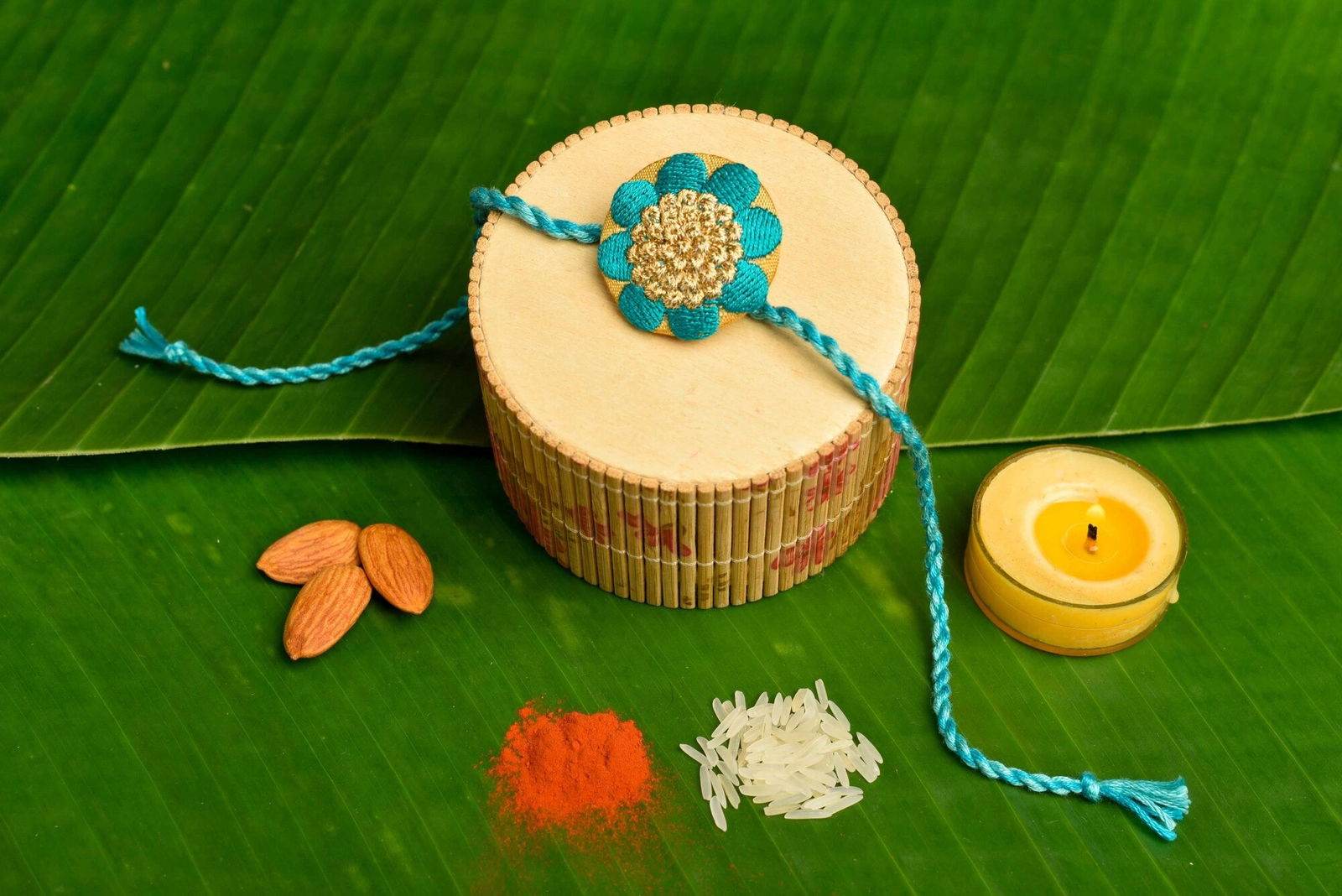 Handmade Turquoise Golden Designer Floral Embroidery Rakhi With Roli And Chawal For Brother - Lookandadorn.com