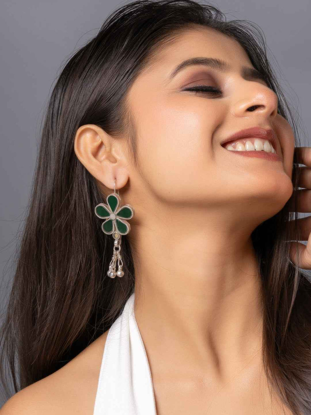 Green enamel Afghani earrings with intricate floral design and dangling pearl accents