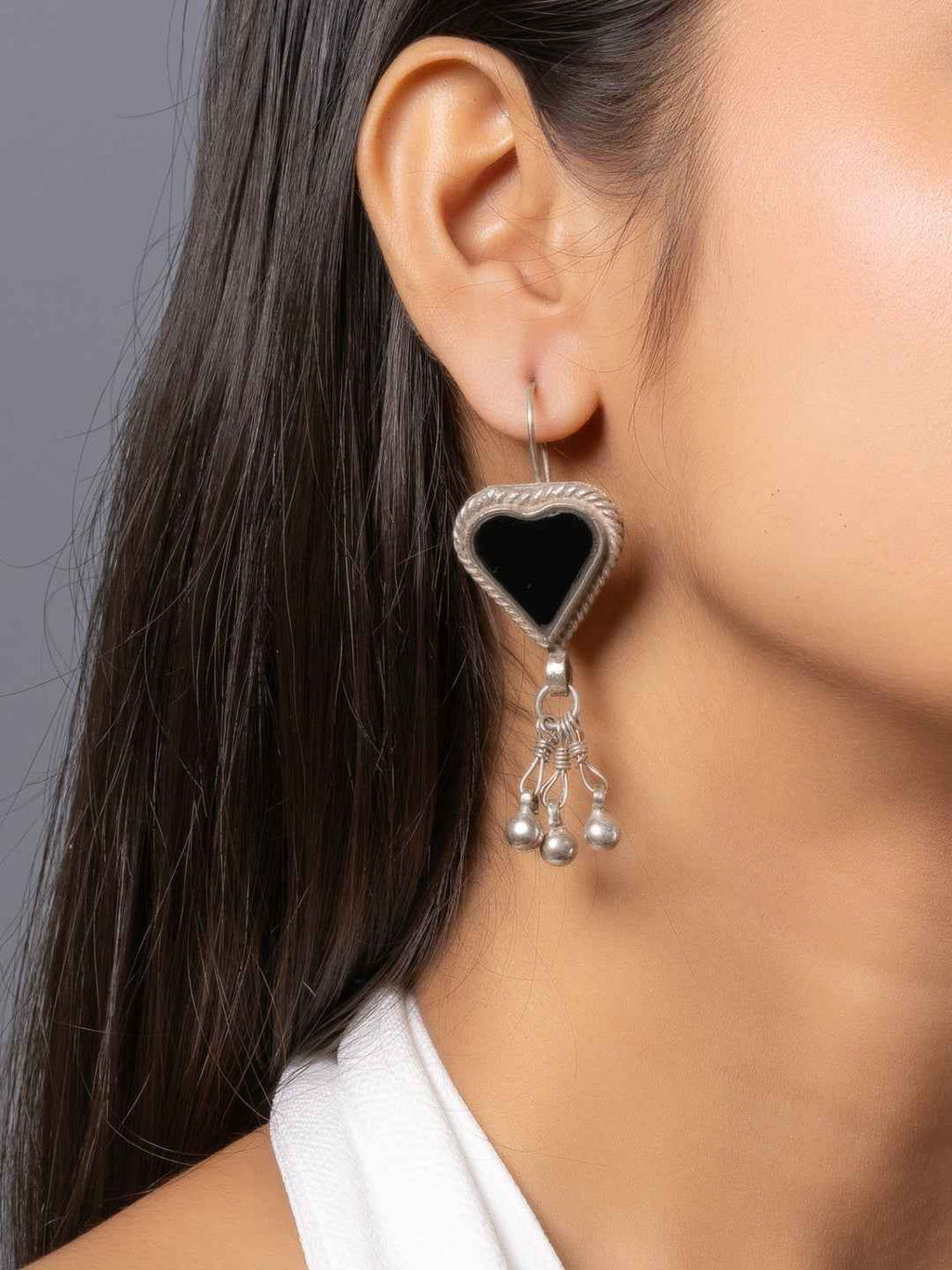 Oxidized silver heart-shaped afghani earrings with black onyx and dangling silver beads