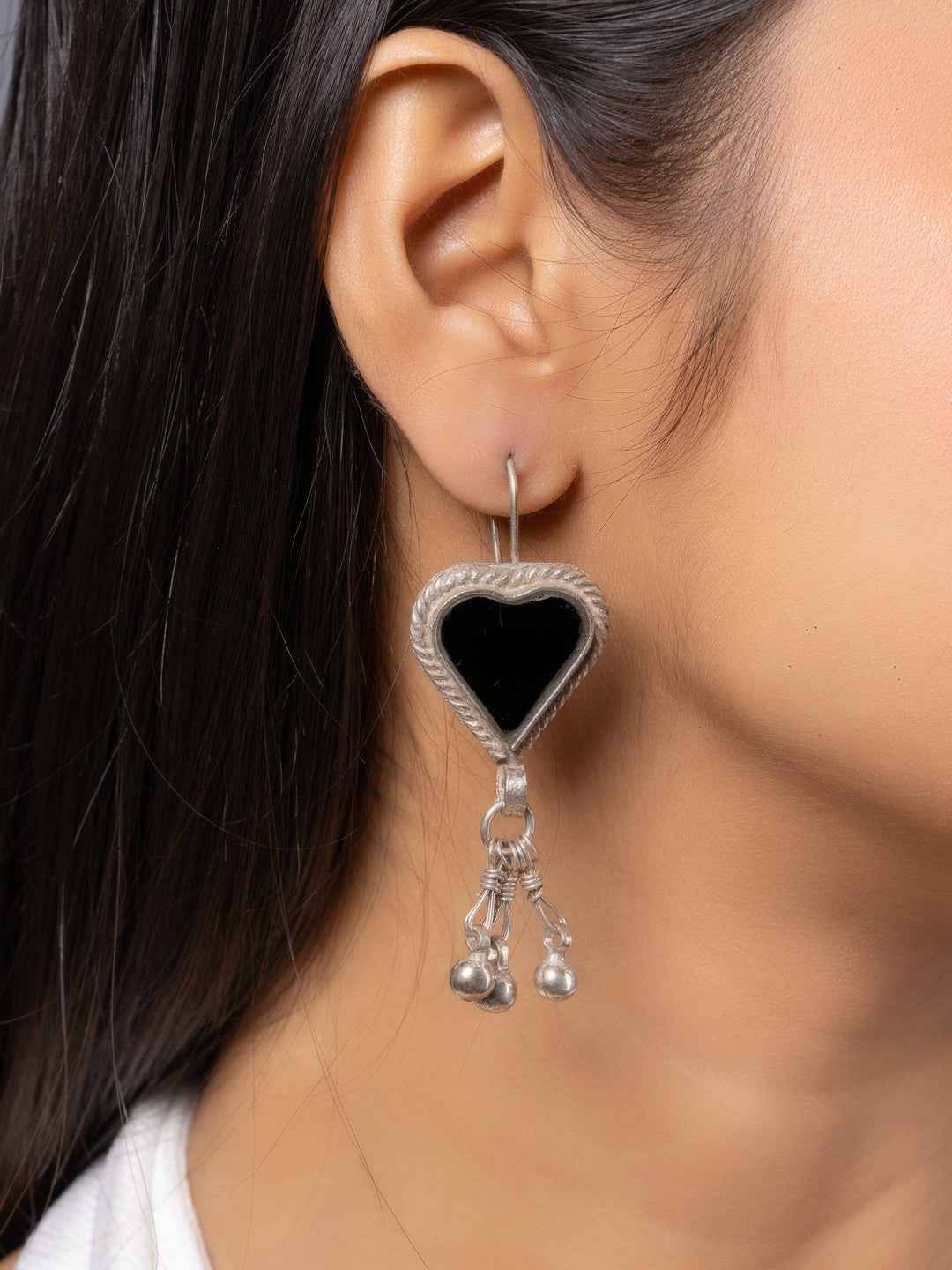 Oxidized silver heart-shaped afghani earrings with black onyx and dangling silver beads