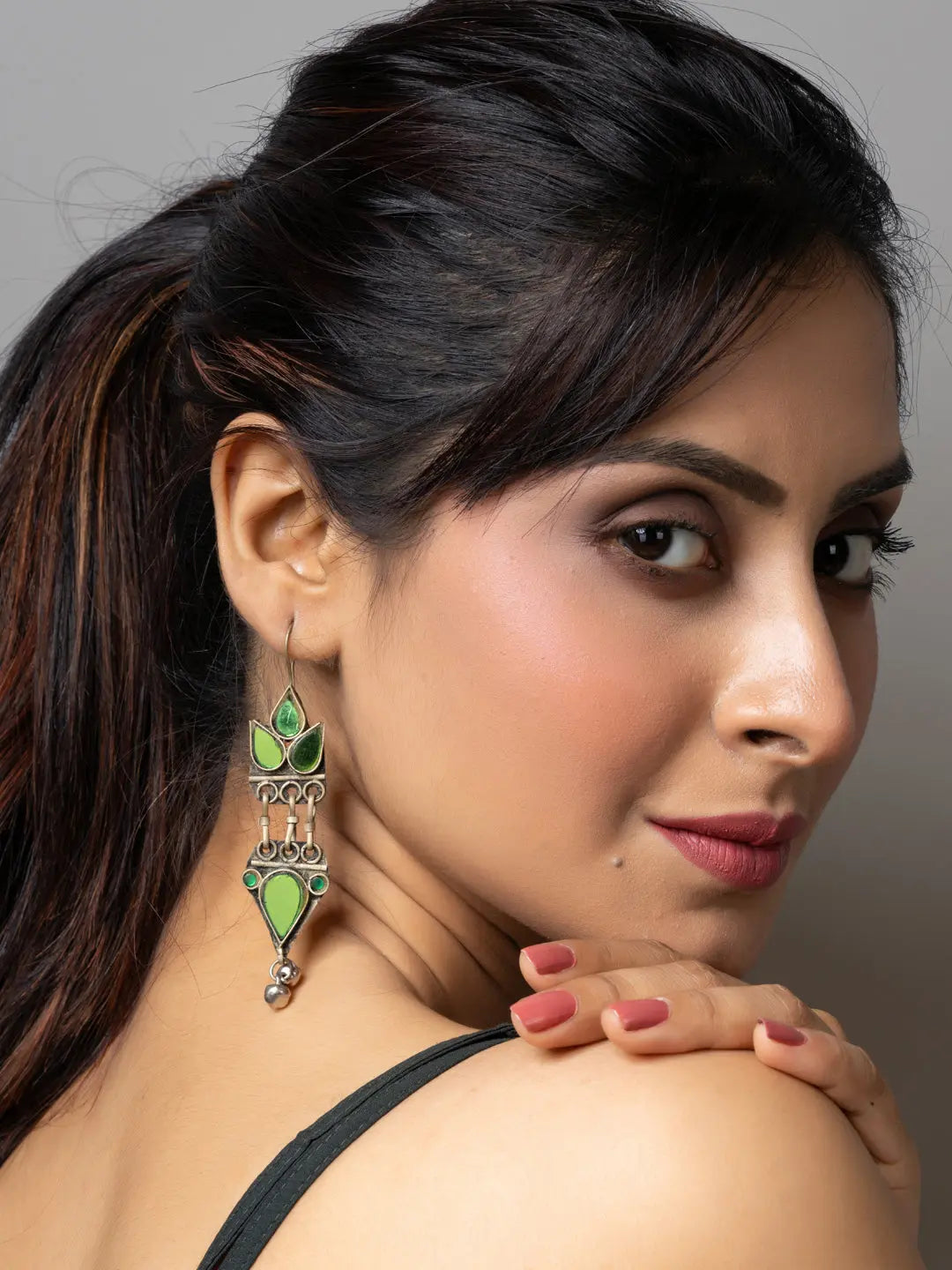 Woman wearing green and silver afghani earrings showcasing traditional Afghani jewellery by LOOK AND ADORN