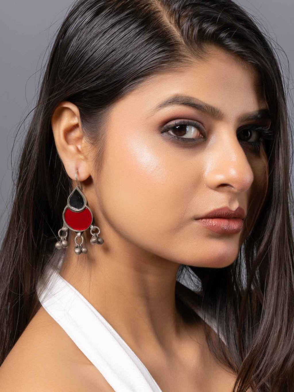Elegant afghani earrings with a red enamel design and silver accents, featuring intricate hanging details