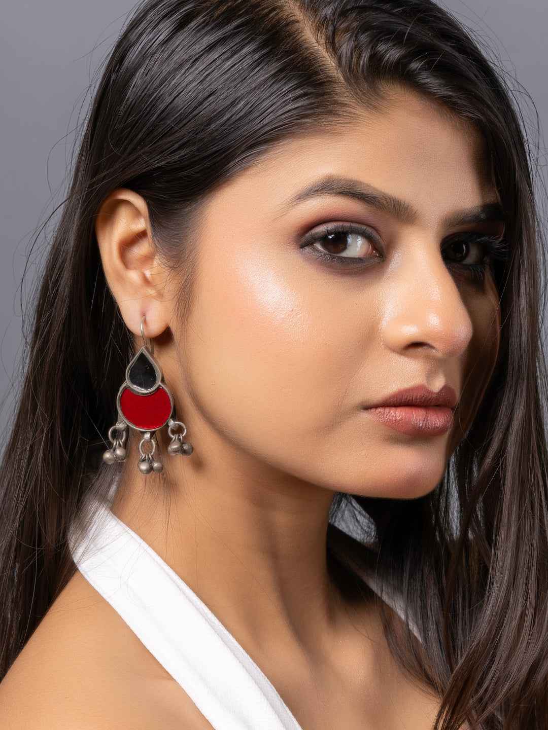 Elegant afghani earrings with a red enamel design and silver accents, featuring intricate hanging details