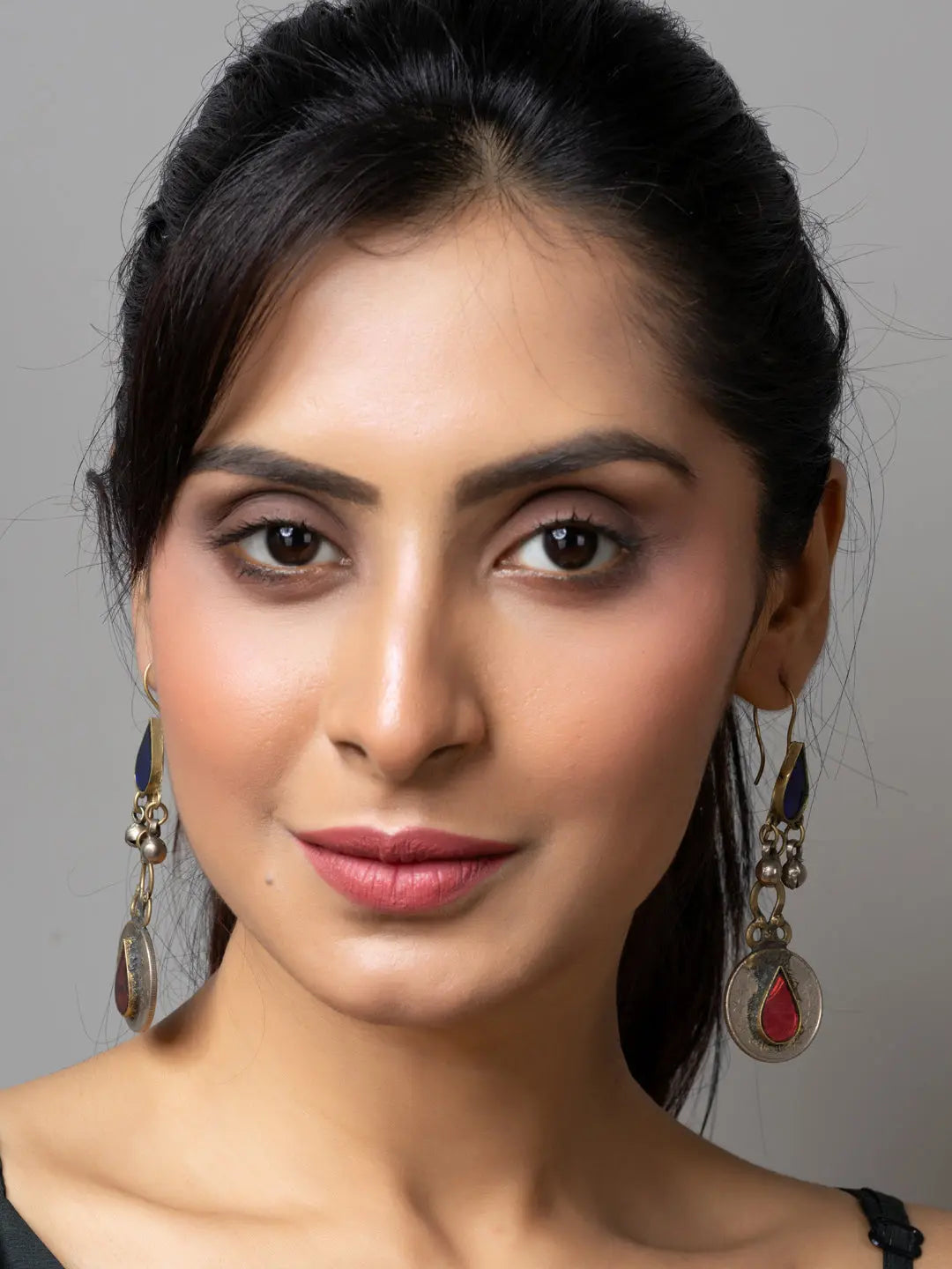 Elegant afghani earrings with intricate design worn by a woman showcasing traditional Afghani jewellery